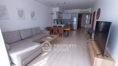Spacious modern living room with open kitchen and stylish decor