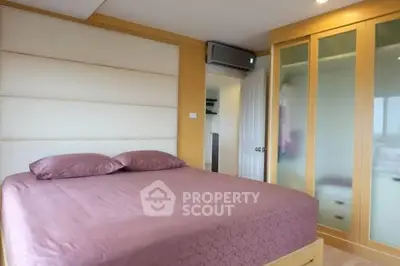 Modern bedroom with stylish wardrobe and air conditioning