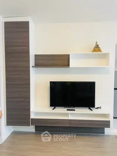 Modern living room with sleek TV unit and stylish shelving