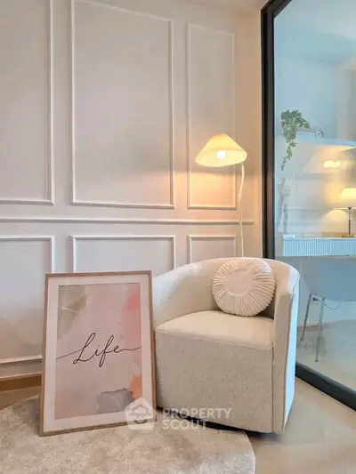 Elegant modern living room corner with stylish armchair and decorative wall art