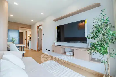 Modern living room with sleek TV setup and cozy decor