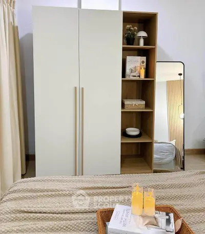 Cozy bedroom with modern wardrobe and stylish decor accents