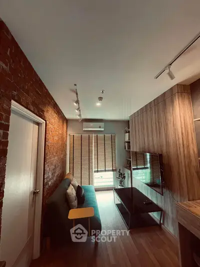 Stylish living room with exposed brick wall and modern furnishings