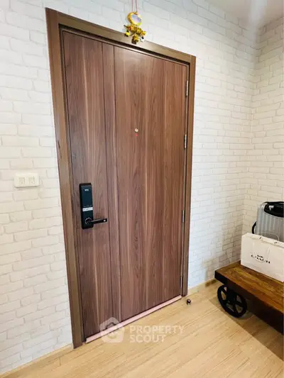 Stylish wooden apartment door with modern electronic lock and chic interior decor.