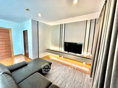 Modern living room with sleek TV setup and stylish decor