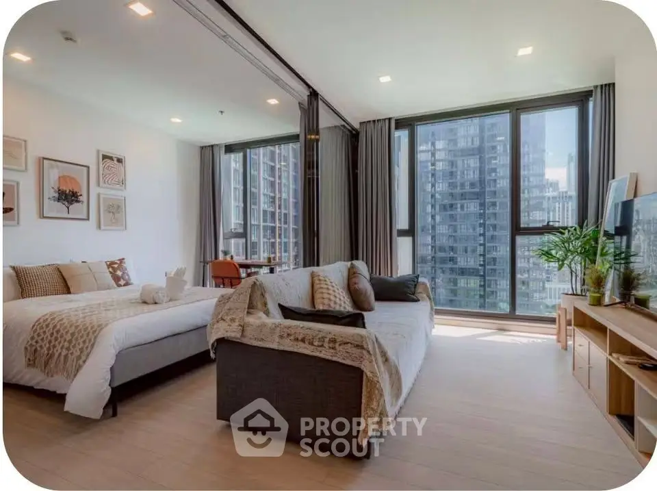 Spacious modern living room with large windows and stylish decor in urban apartment