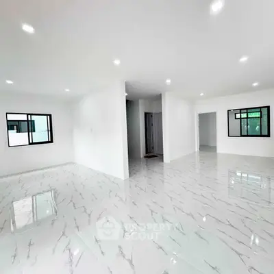 Spacious modern interior with glossy marble flooring and large windows