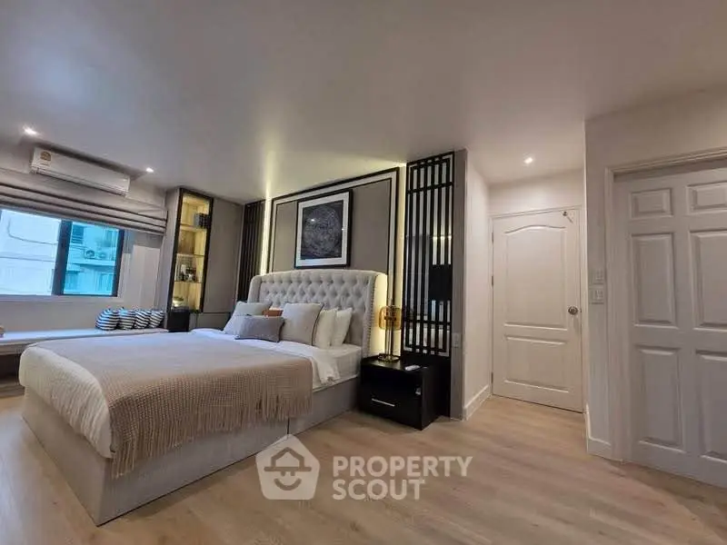 Luxurious modern bedroom with elegant decor and ambient lighting, perfect for relaxation and comfort.