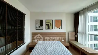 Modern bedroom with stylish decor and large window view