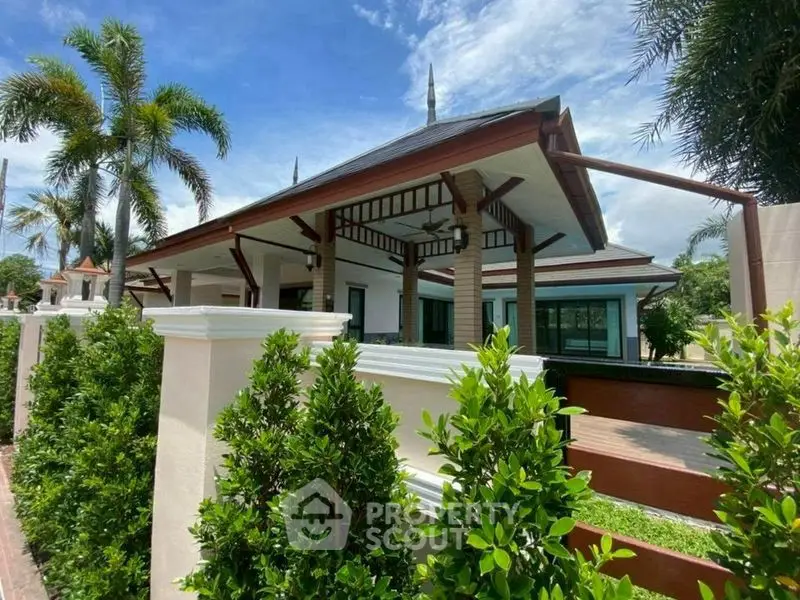 Stunning tropical villa with lush greenery and modern architecture, perfect for luxurious living.