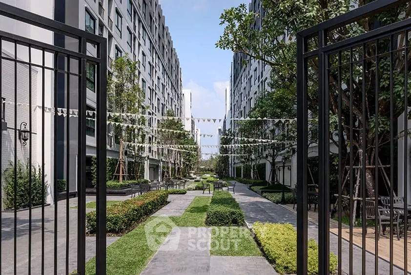 Modern apartment complex with lush garden and pathway view