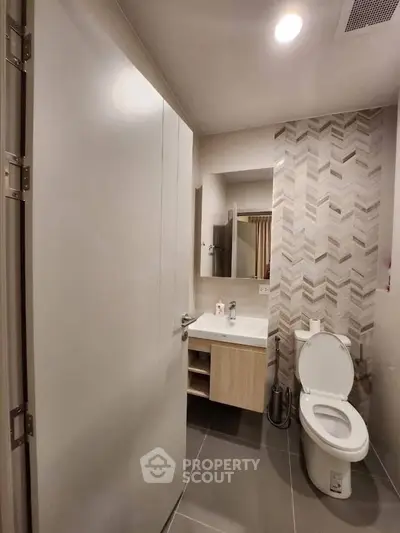 Modern bathroom with sleek design and stylish tile accents