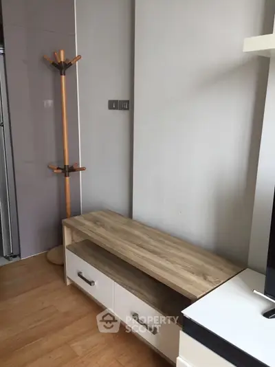 Modern interior with wooden flooring and sleek furniture in a stylish apartment.