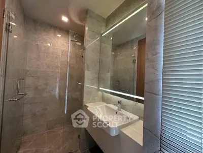 Luxurious modern bathroom with elegant marble tiles and sleek fixtures