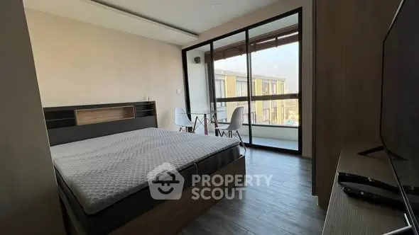 Modern bedroom with balcony view and stylish furniture