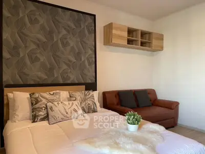 Cozy bedroom with stylish decor and comfortable seating area