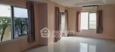 Spacious empty living room with large windows and air conditioning unit, perfect for customization.