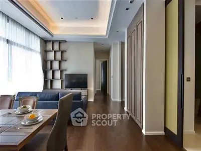 Spacious modern living room with elegant wooden flooring and stylish furniture