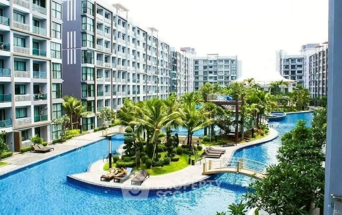 Luxurious apartment complex with stunning pool and lush landscaping
