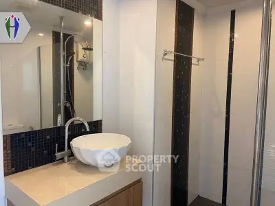 Modern bathroom with stylish sink and elegant tile design