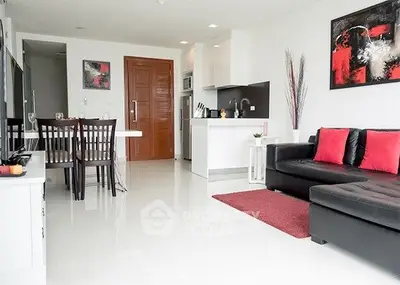 Modern open-plan living room with sleek kitchen and stylish decor