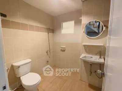 Spacious bathroom with modern fixtures and neutral tile design
