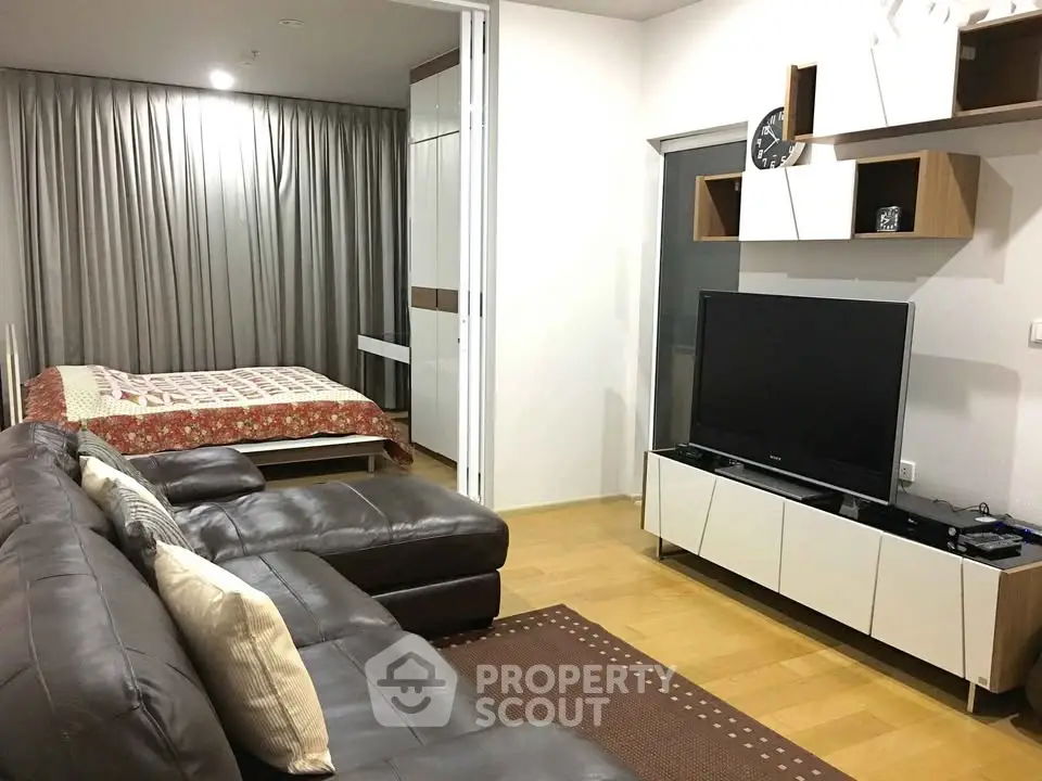 Modern studio apartment with cozy living area and stylish bedroom