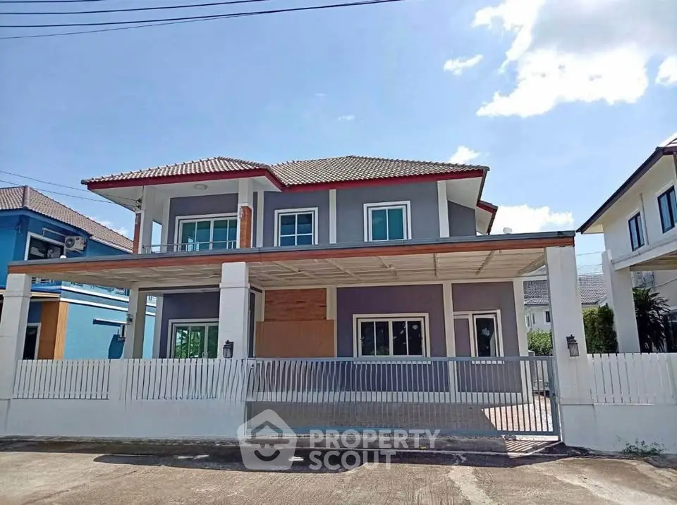 Stunning two-story house with modern design and spacious carport in a serene neighborhood.