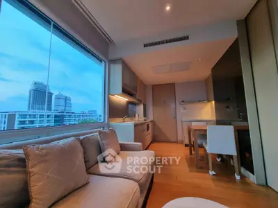 Modern living room with city view and open kitchen layout