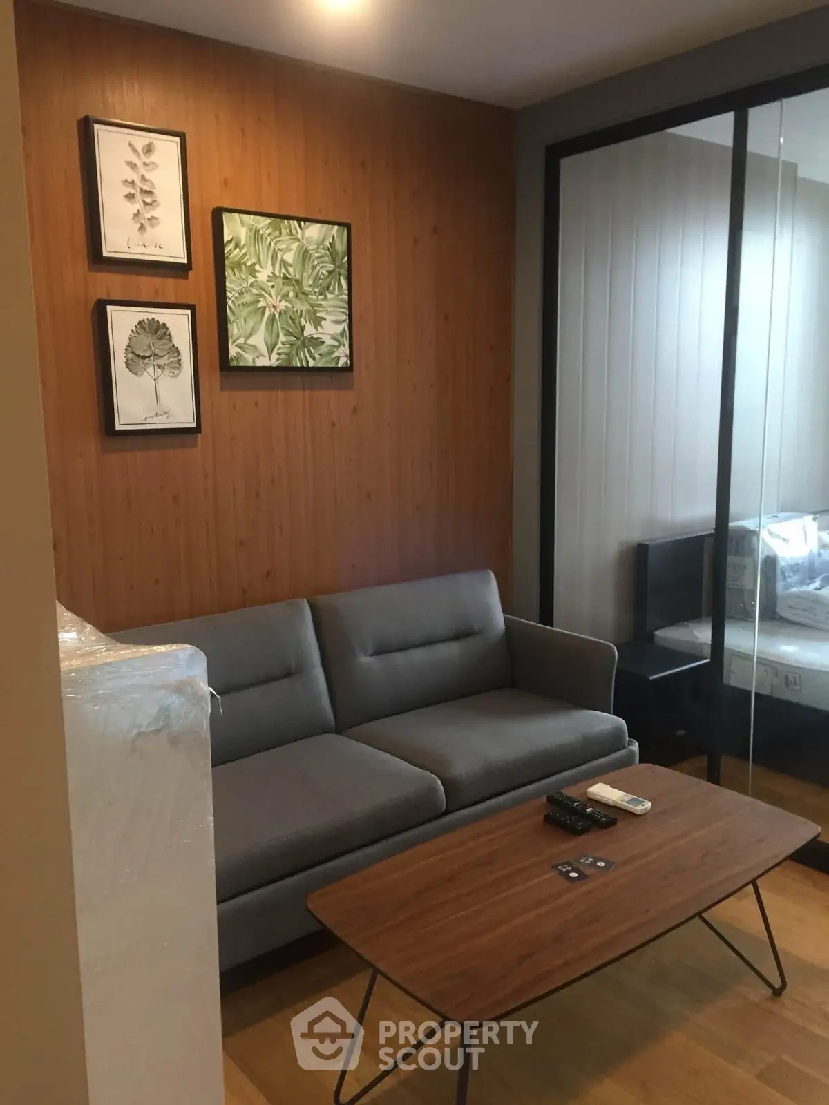 Modern living room with stylish decor and comfortable seating in a cozy apartment.