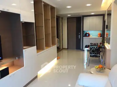 Modern living room with sleek built-in shelves and cozy seating area.