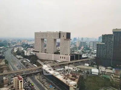 Stunning aerial view of a unique architectural building in a bustling cityscape.