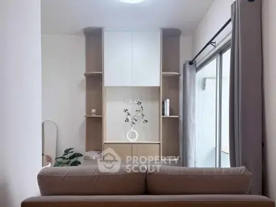 Modern living room with stylish shelving and sliding glass door