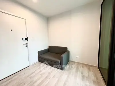 Cozy small living room with modern sofa and wooden flooring