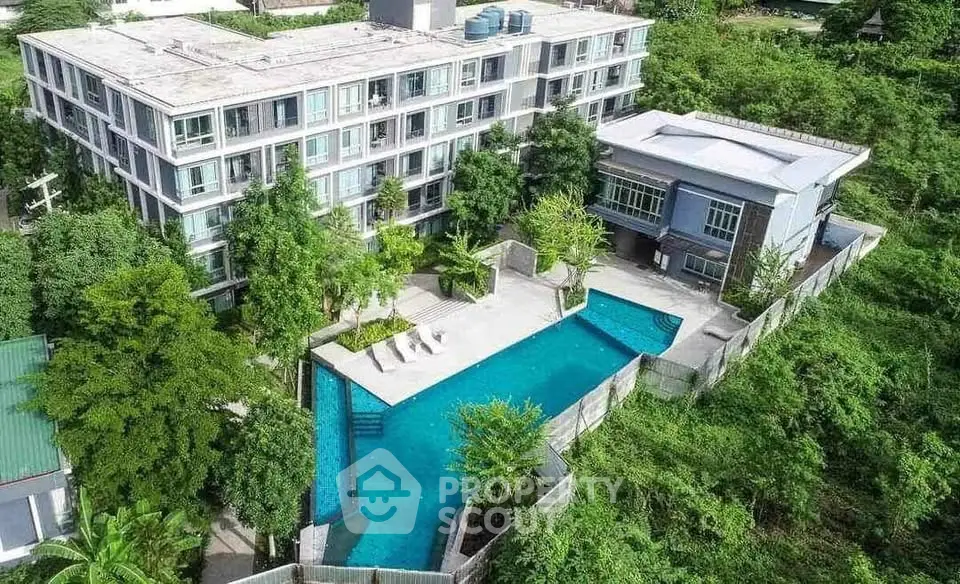 Luxurious apartment complex with stunning pool and lush greenery