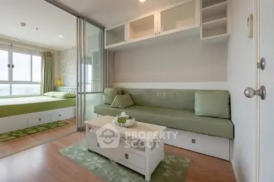 Modern studio apartment with sliding glass doors and stylish green decor.