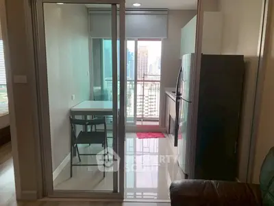 Modern condo kitchen with balcony view in urban high-rise