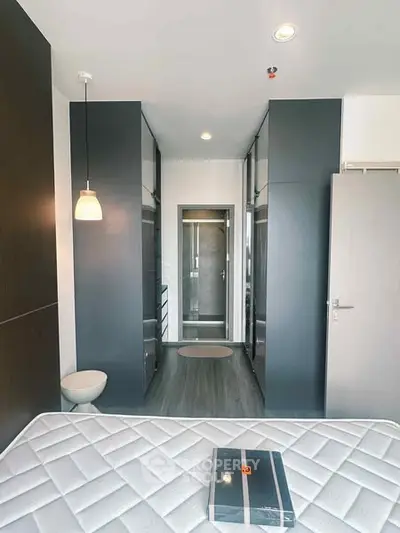 Modern bedroom with sleek design and ample storage space