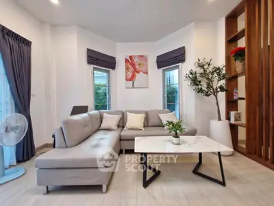 Modern living room with stylish gray sectional sofa and elegant decor