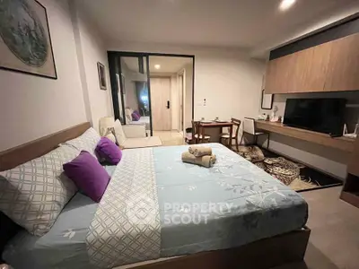 Modern bedroom with cozy decor and stylish furniture in a well-lit apartment