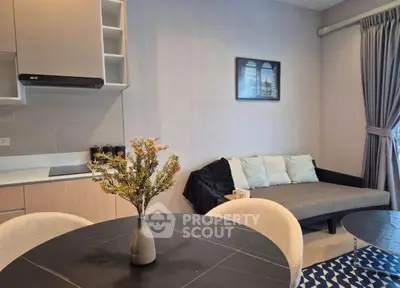 Modern living room with stylish decor and cozy seating area, perfect for relaxation and entertaining.