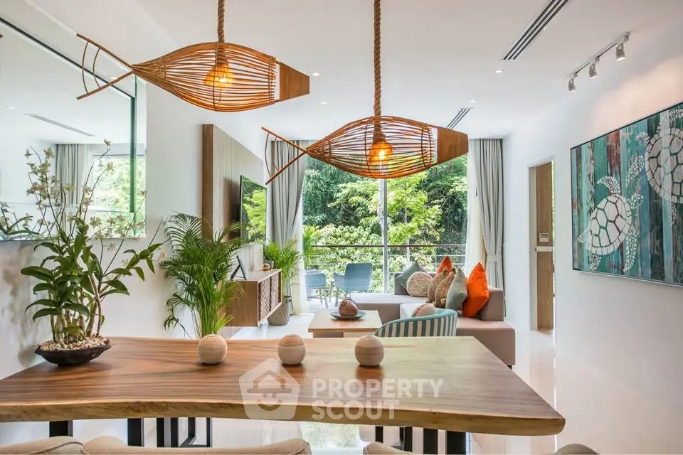 Luxurious open-plan living room with stylish decor and garden view