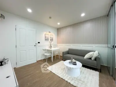 Modern living room with cozy sofa, stylish decor, and elegant lighting in a chic apartment.