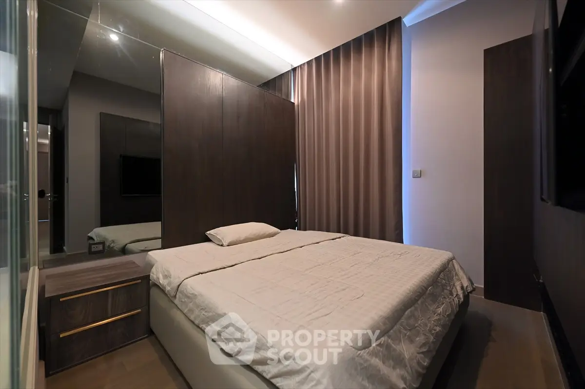 Modern bedroom with sleek design and ambient lighting