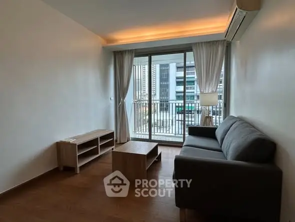 Modern living room with balcony view in urban apartment