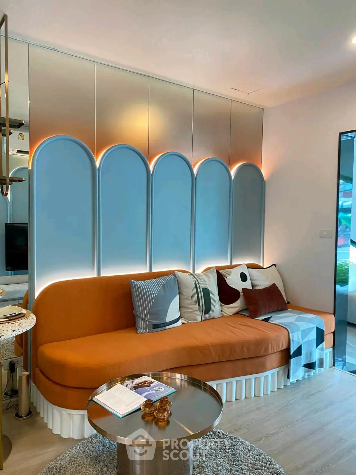 Modern living room with stylish orange sofa and elegant decor