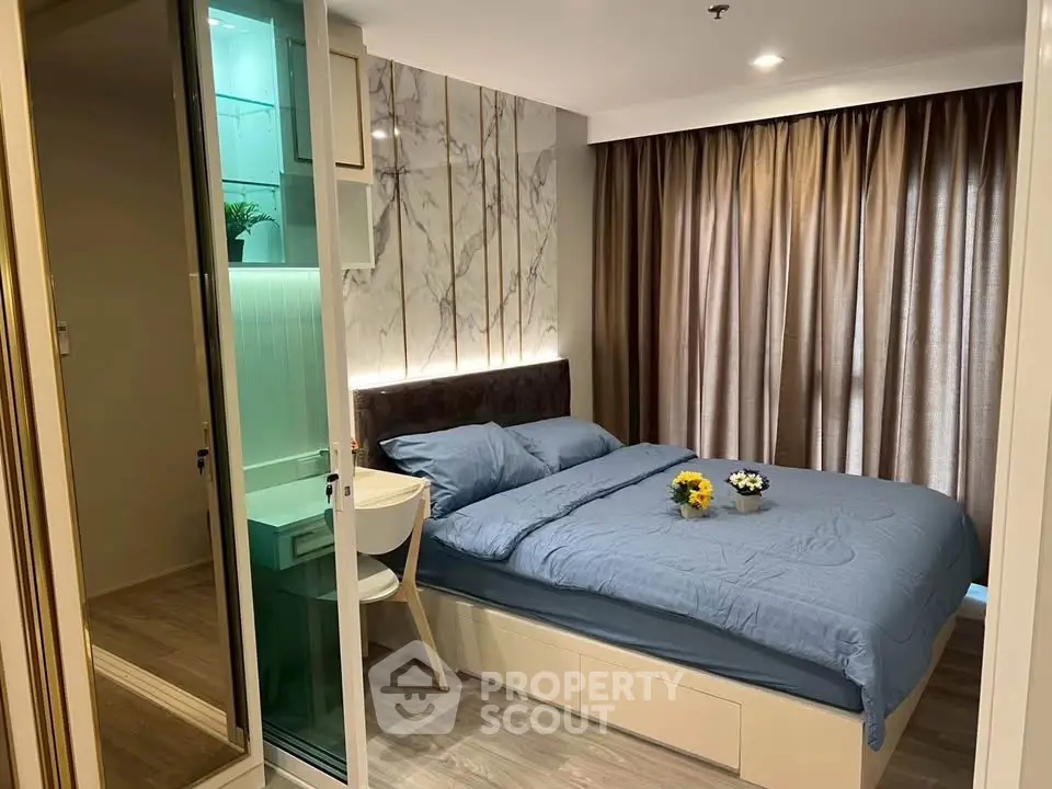 Modern bedroom with stylish decor and ample natural light