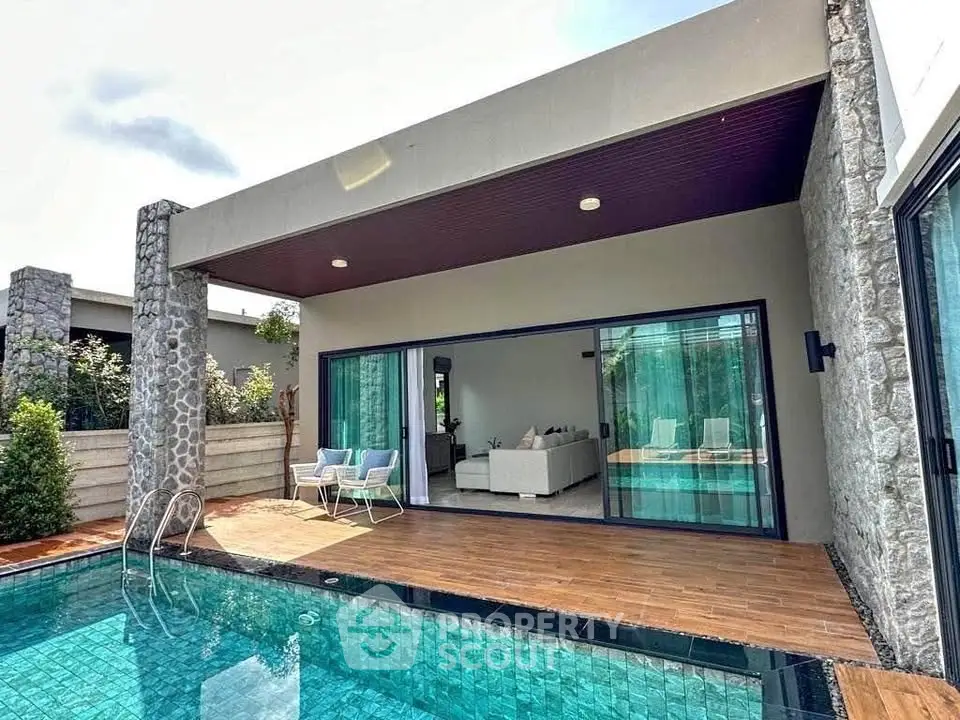 Luxurious modern villa with private pool and spacious patio area, perfect for relaxation and entertainment.