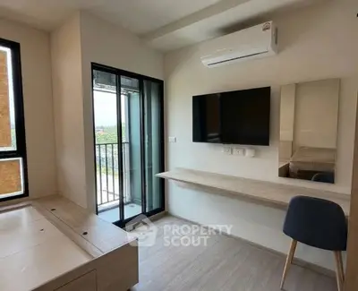 Modern study room with balcony access and sleek furniture design