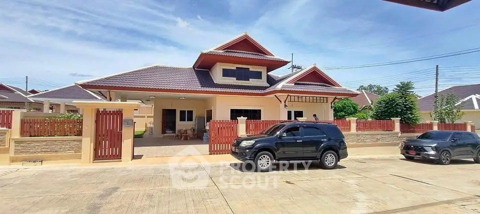 Charming suburban house with modern roof design and spacious driveway in a serene neighborhood.